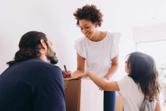 Family with moving boxes.