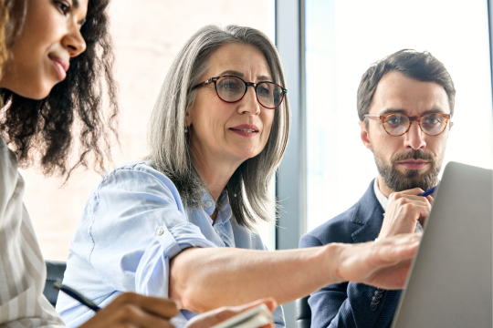 Group of businesspeople working as a team in an office.