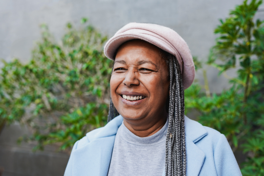 Smiling adult woman.passionate pension and health benefits advocates.